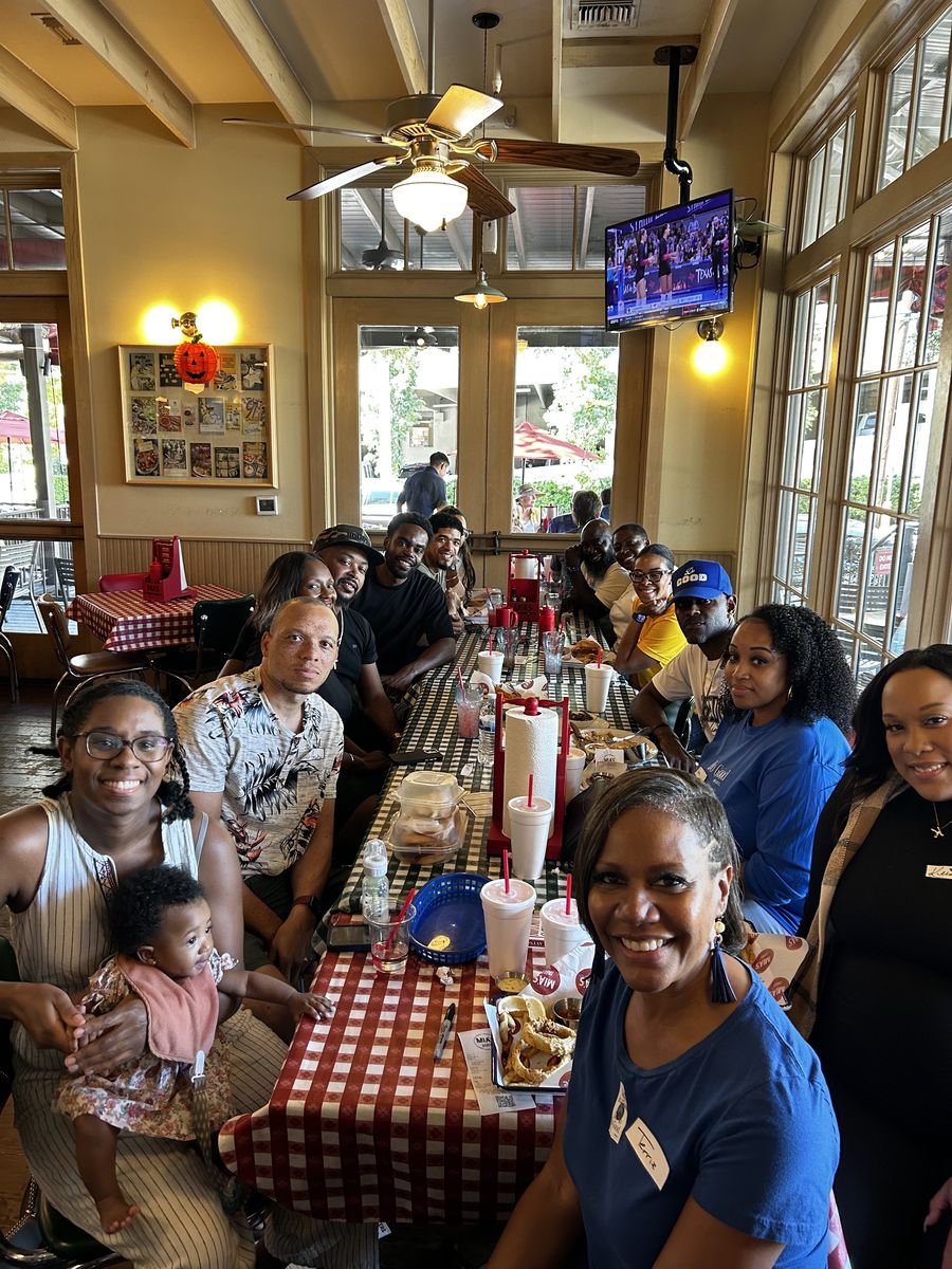 Couples and families sharing a meal at a Kingdom Kouples fellowship dinner
