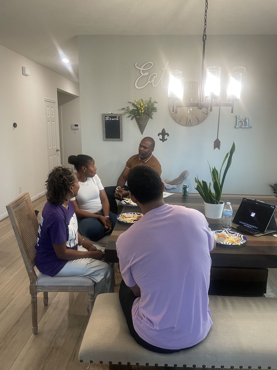 Couples talking around a dining table during a marriage small group