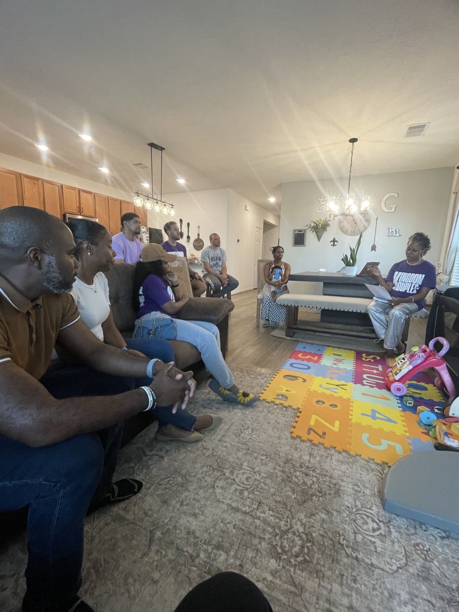Husbands and wives seated together during a Houston marriage small group meeting